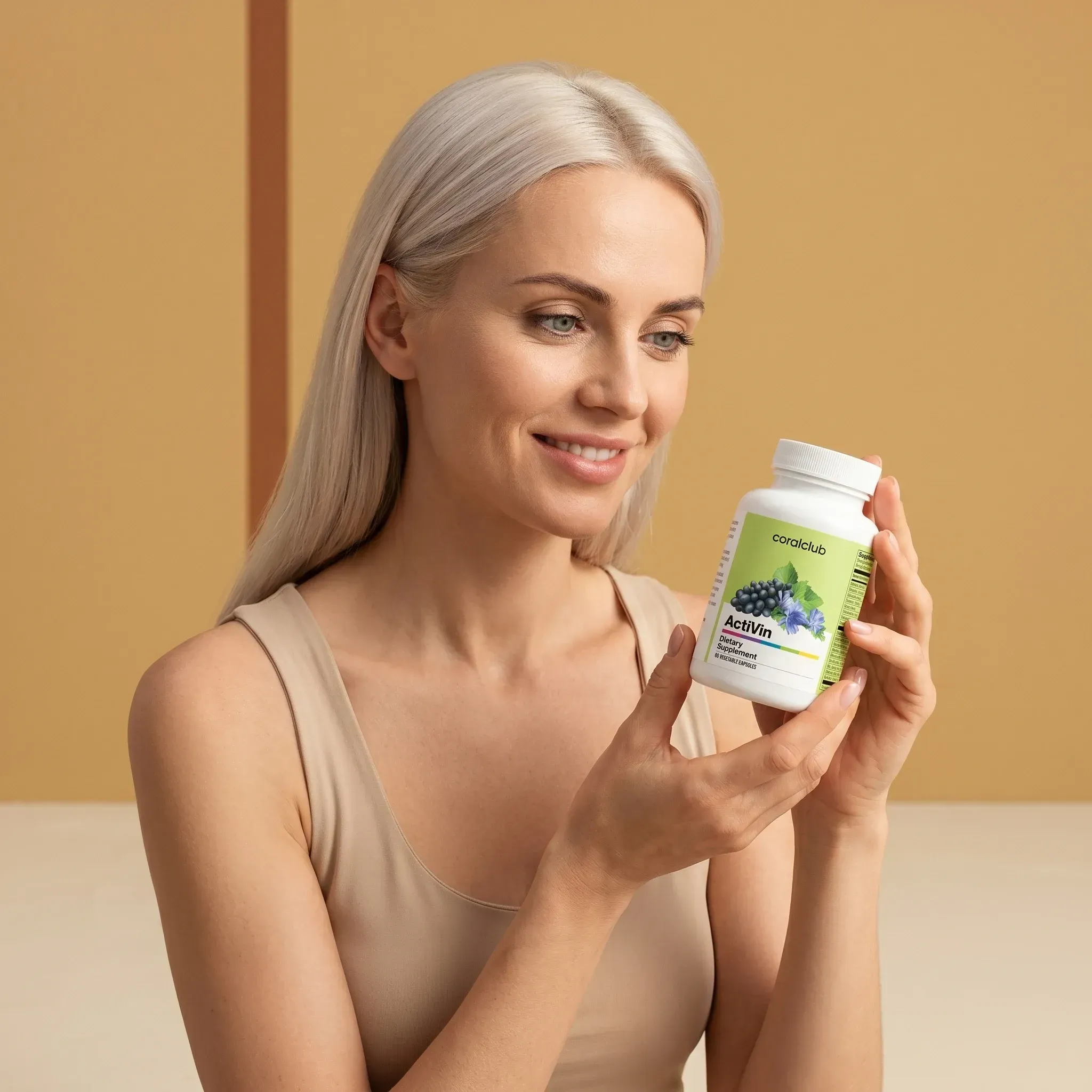 ActiVin lifestyle image featuring a woman holding the supplement bottle with a smile.
