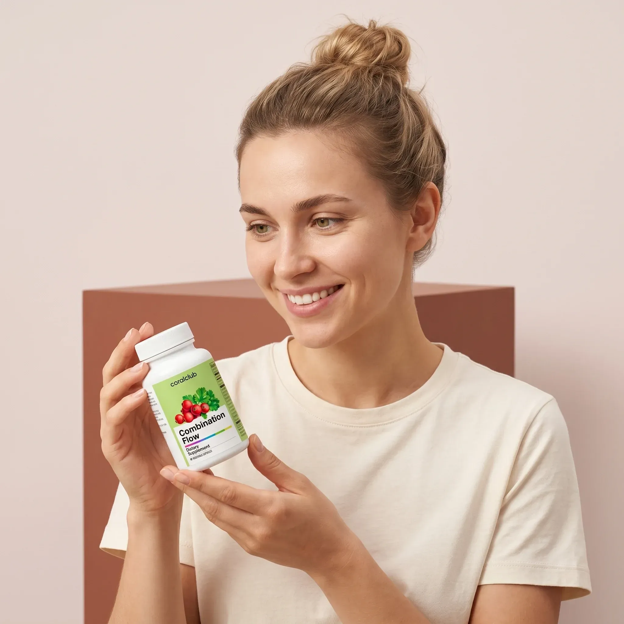 Woman holding Combination Flow supplement bottle in a lifestyle setting.
