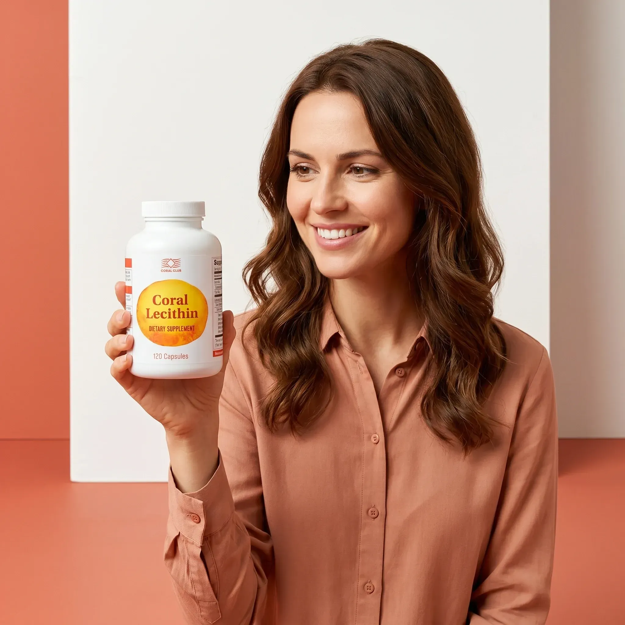 Woman holding a bottle of Coral Lecithin dietary supplement in a lifestyle setting.