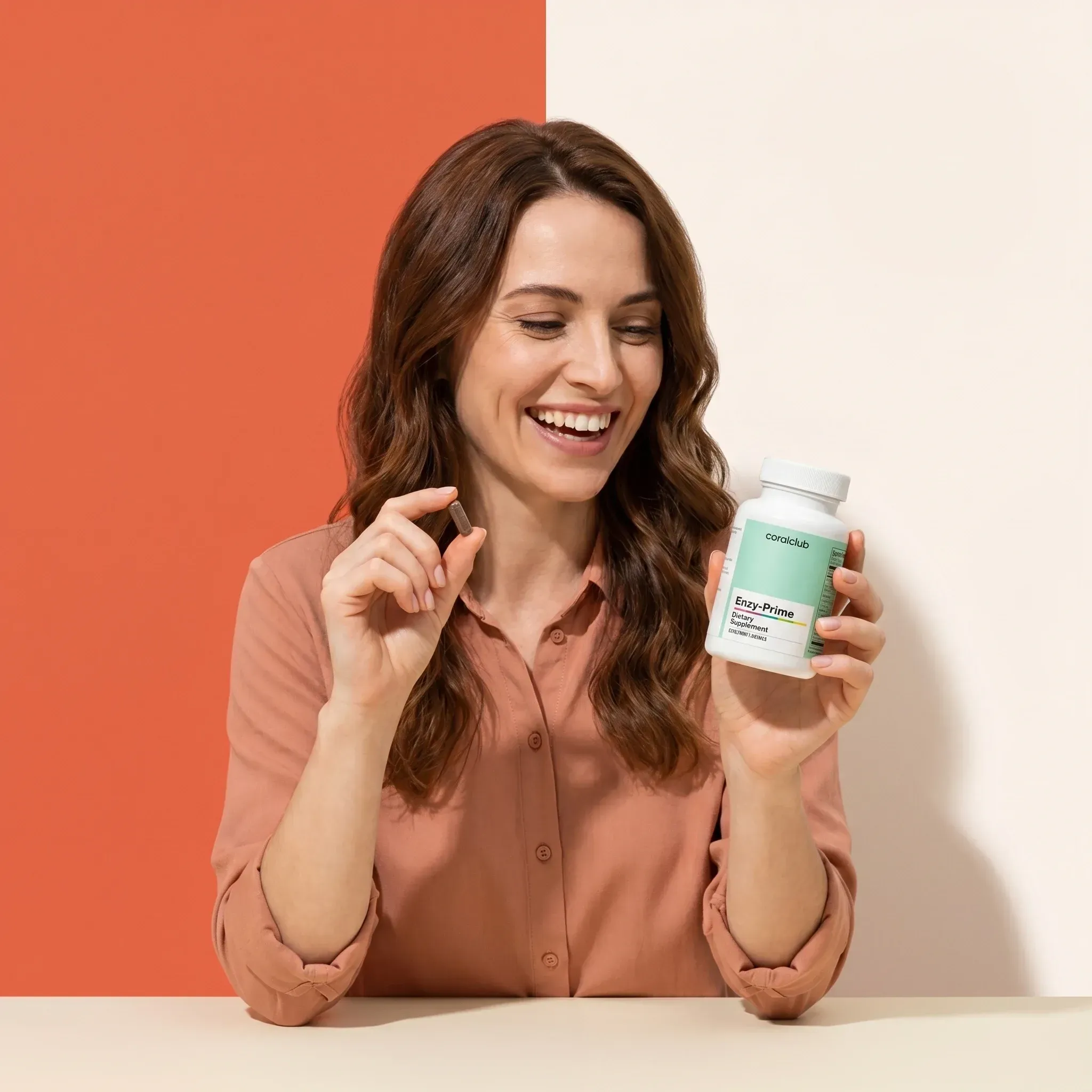 Woman smiling while holding a bottle of Enzy-Prime against a colorful background.