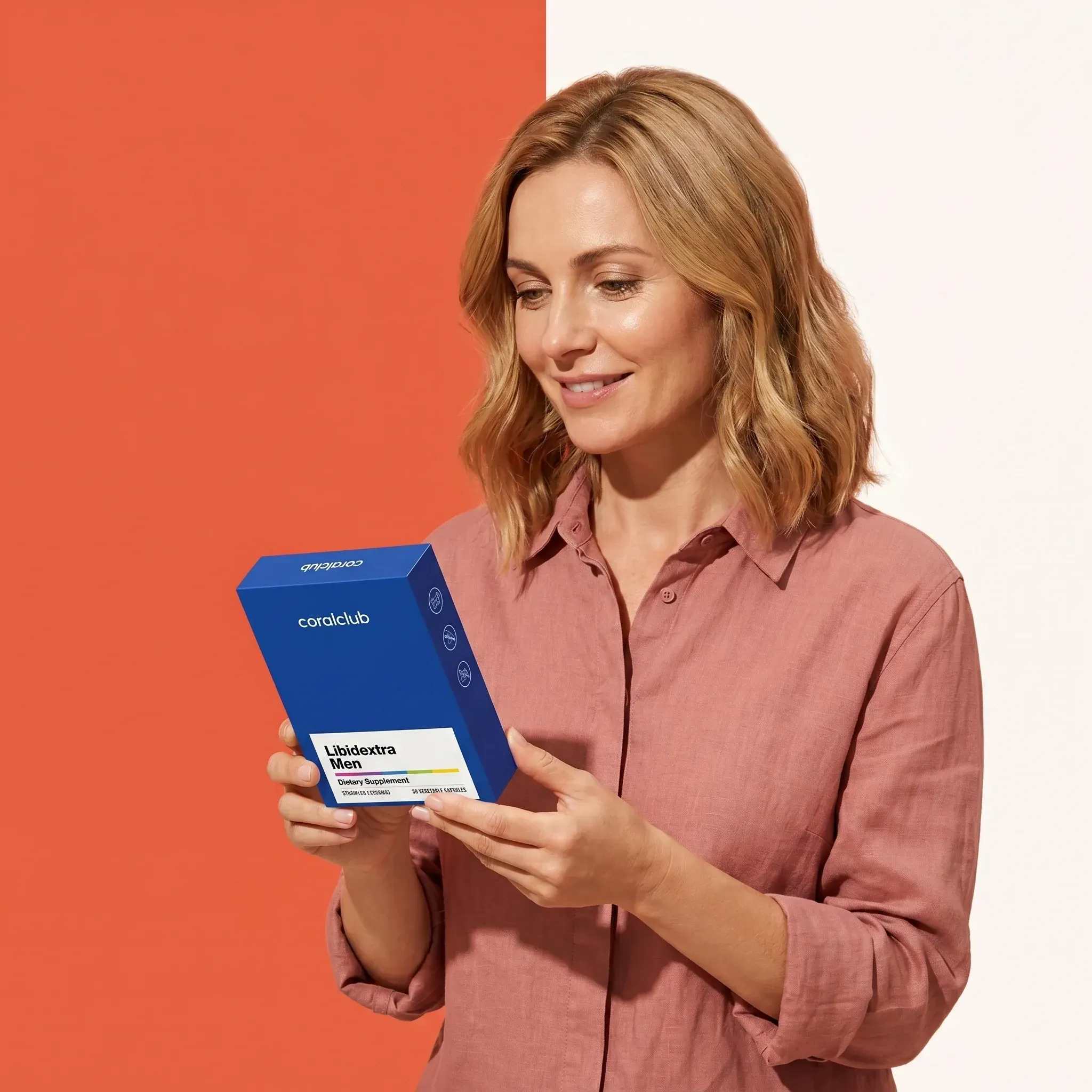 Libidextra Men lifestyle shot, woman examining blue box with product details against a colorful background.