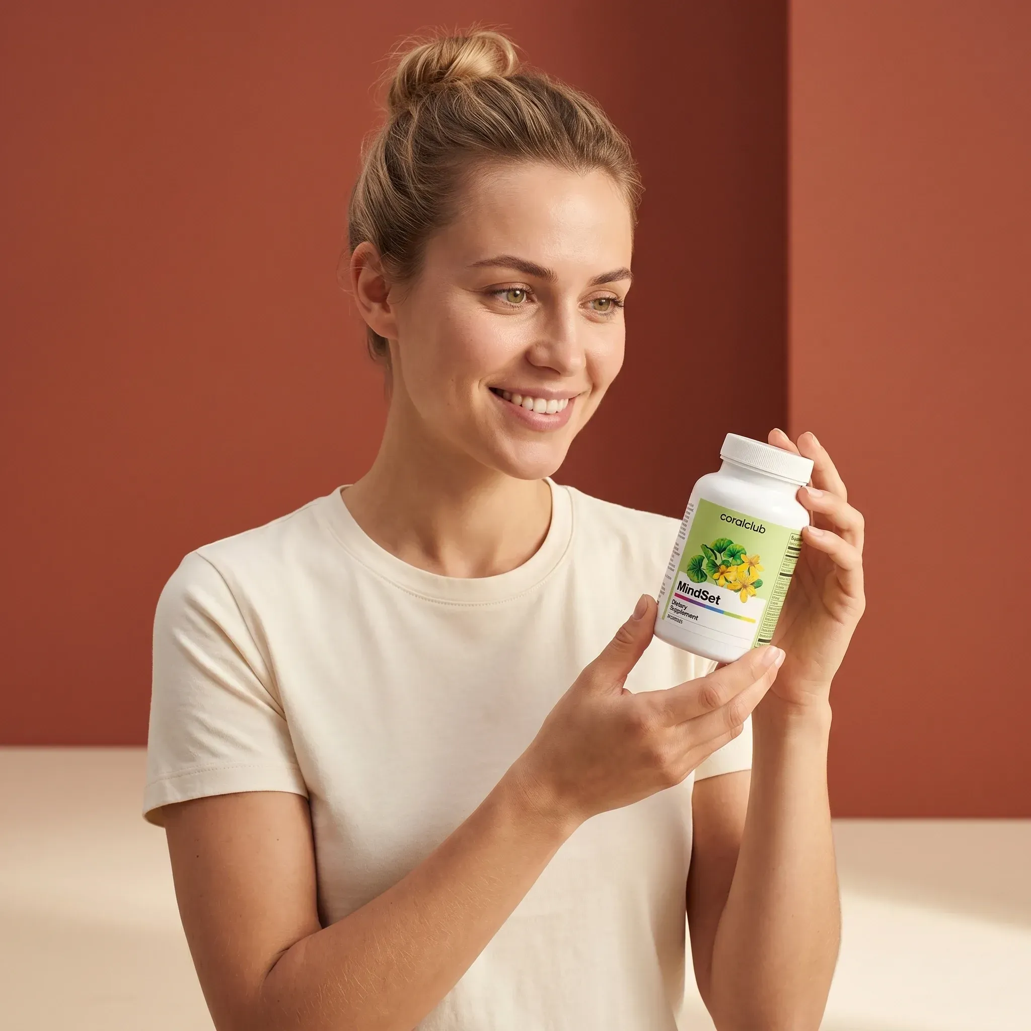 MindSet lifestyle product with a woman holding the bottle, smiling against a warm-toned background.