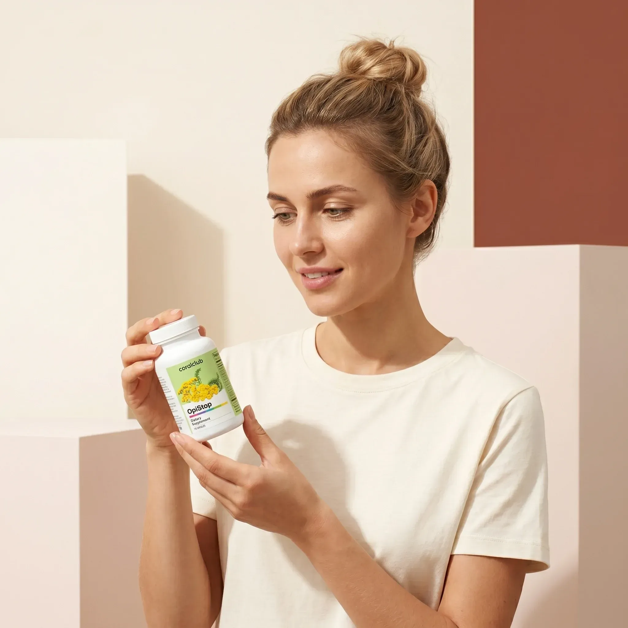 OpiStop lifestyle image featuring a woman holding the product bottle against a soft pastel background.