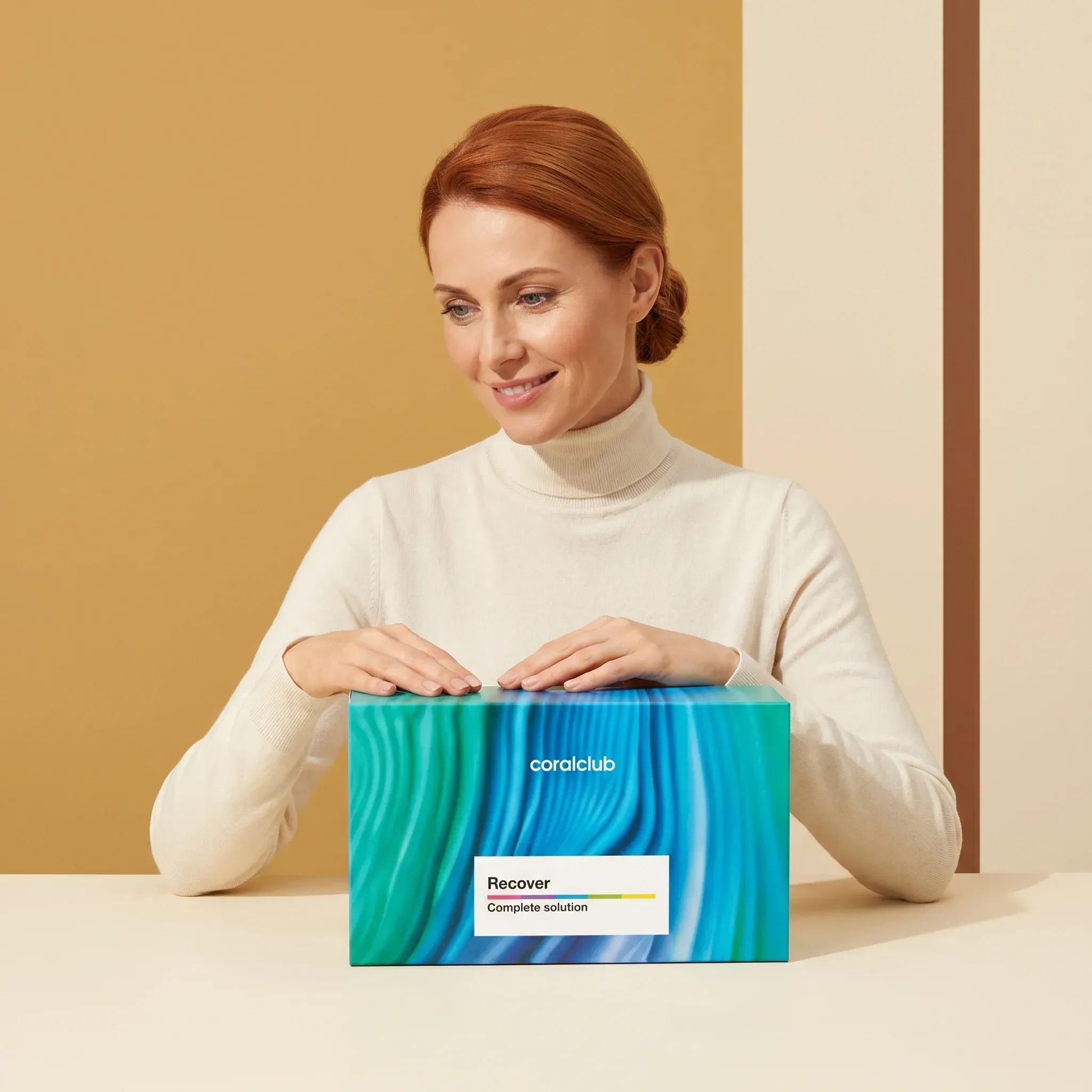 Woman holding a Recover Pack box in a lifestyle setting with a colorful background.
