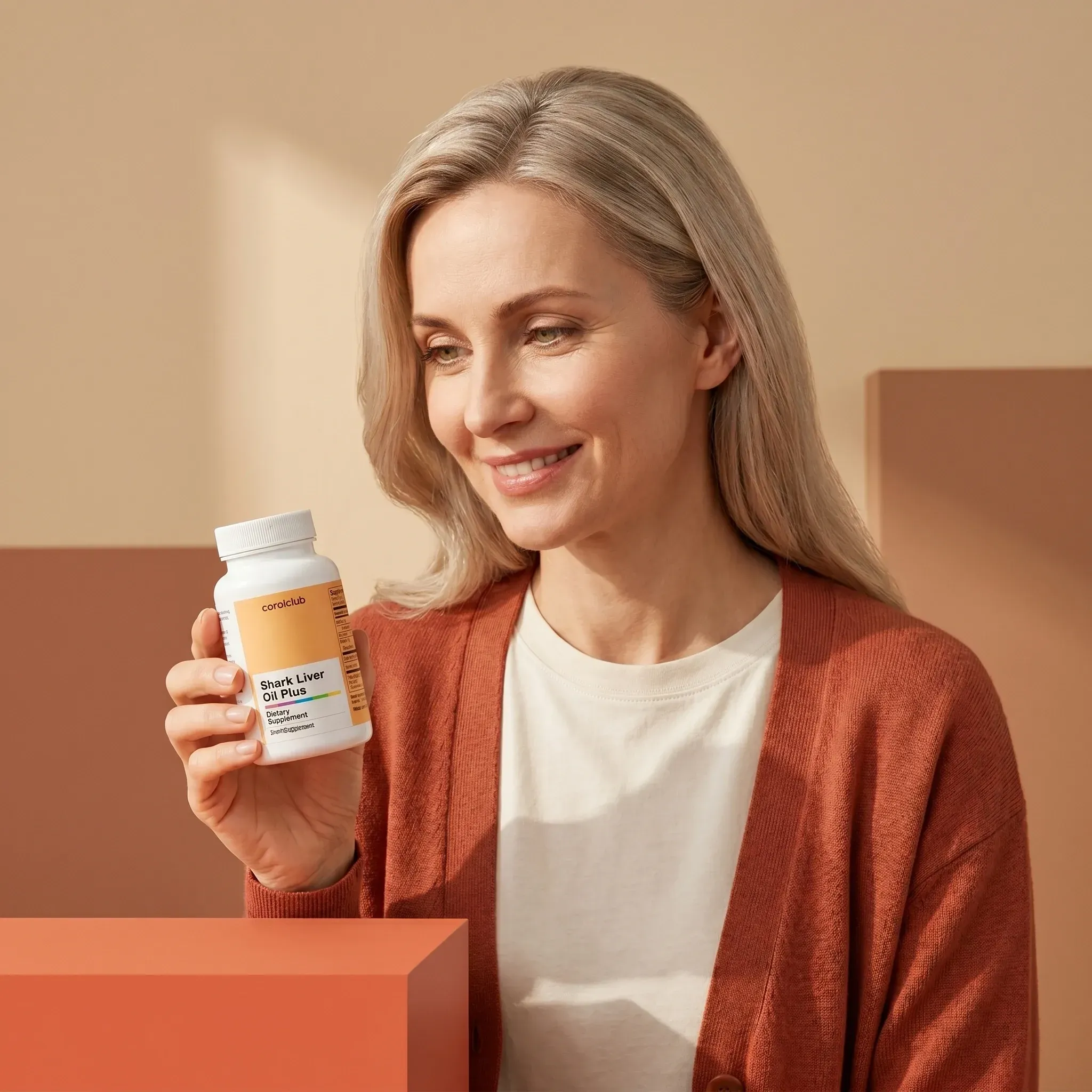 Woman holding Shark Liver Oil Plus supplement in a warm, minimalist setting.